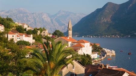 Buildings with orange roofs along the coastline of Perast, Montenegro