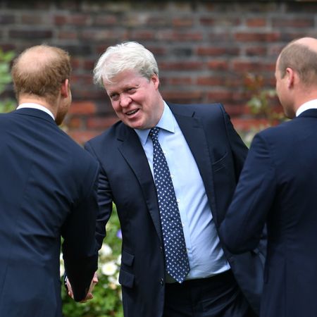 Earl Spencer shaking hands with Prince Harry and Prince William
