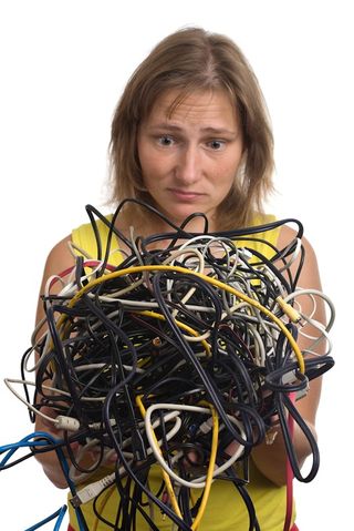 tangled wires and frustrated woman
