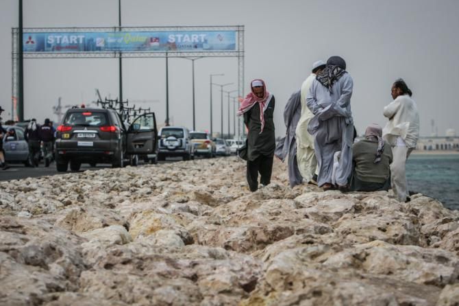 Locals hunkered down for the windy stage 1 start.