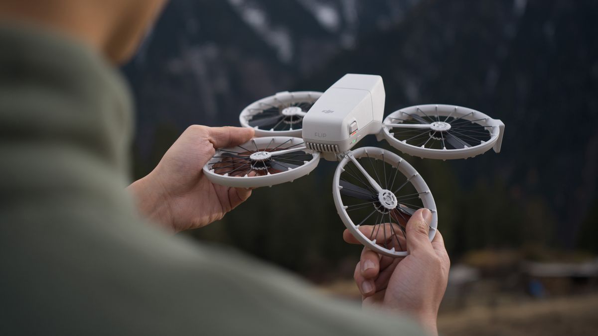 DJI Flip drone in hands of person who is folding it up