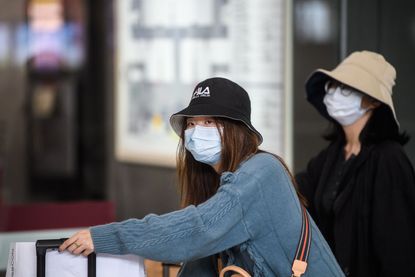 Tourists in face masks in Hong Kong