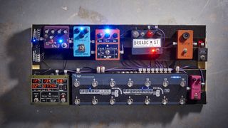 Overhead shot of well-stocked guitar pedalboard