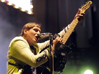 Win Butler, frontman, performing in 2011