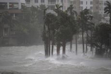 Water flowing out of the Miami River floods a walkway as Hurricane Irma passes through on Sept. 10, 2017, in Miami, Florida. 