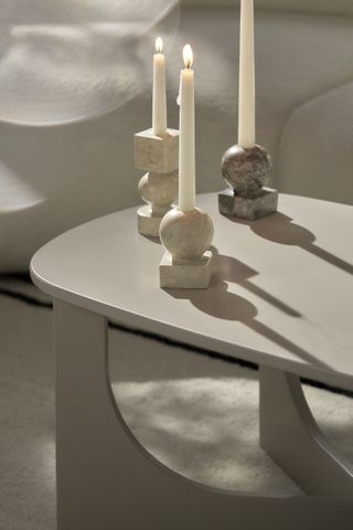 marble candlesticks on a coffee table