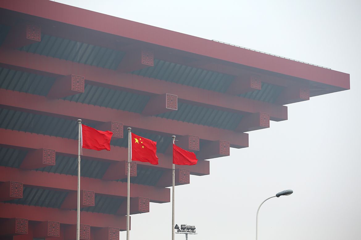The Chinese flag flies alongside the race