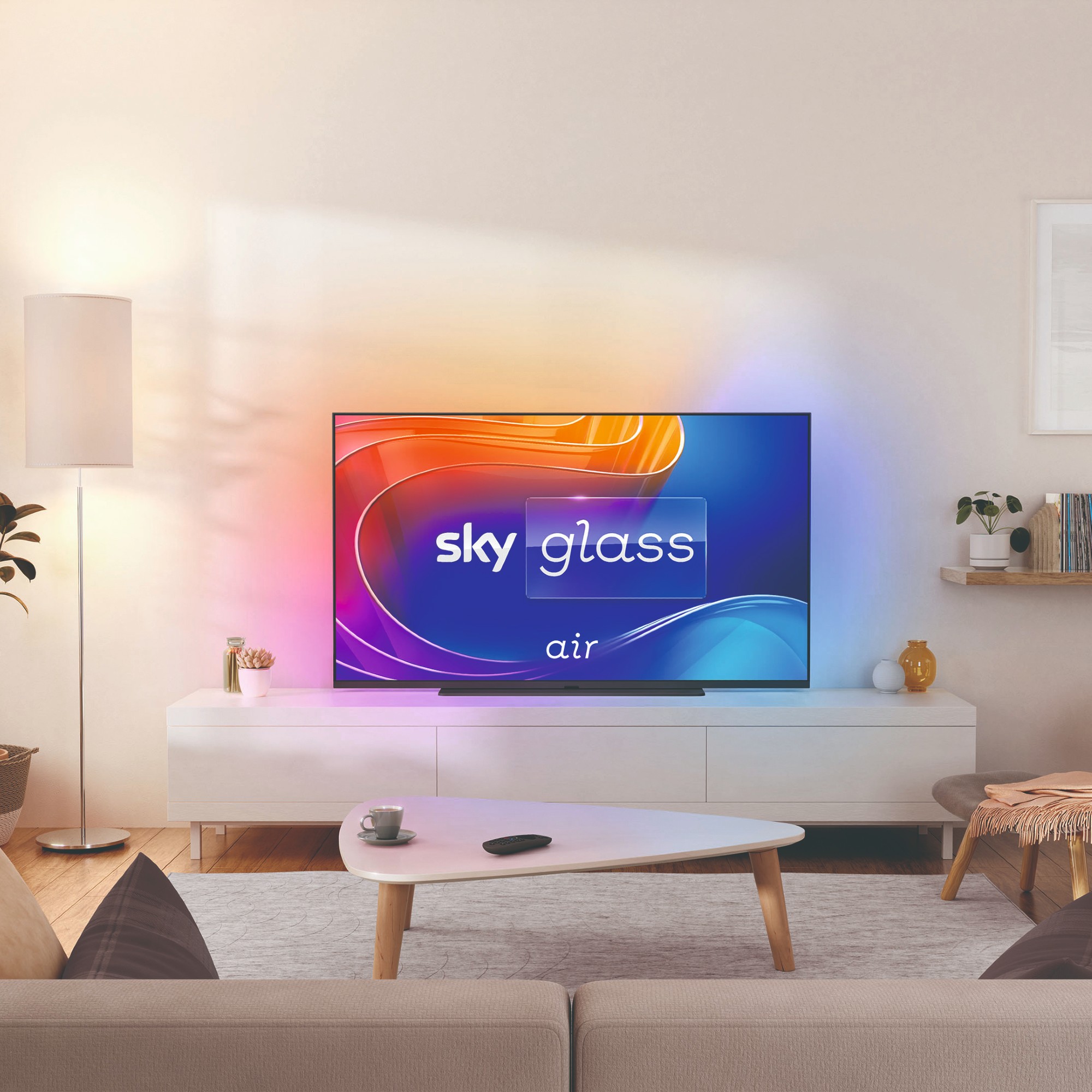 Sky Glass Air TV mounted on the wall in a white minimalist living room