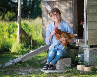 Jane Howorth of the British Hen Welfare Trust with a rehomed fomer battery chicken