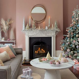 Living room with pastel wall colours and a white decorate christmas tree