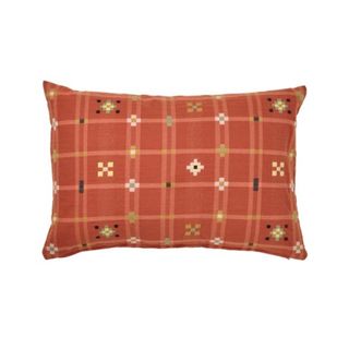 A rectangular throw pillow with a grid pattern