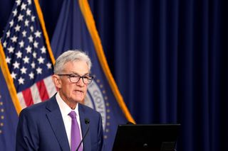 Federal Reserve Chair Jerome Powell speaks at a press conference on May 1, 2024, in front of an American flag.