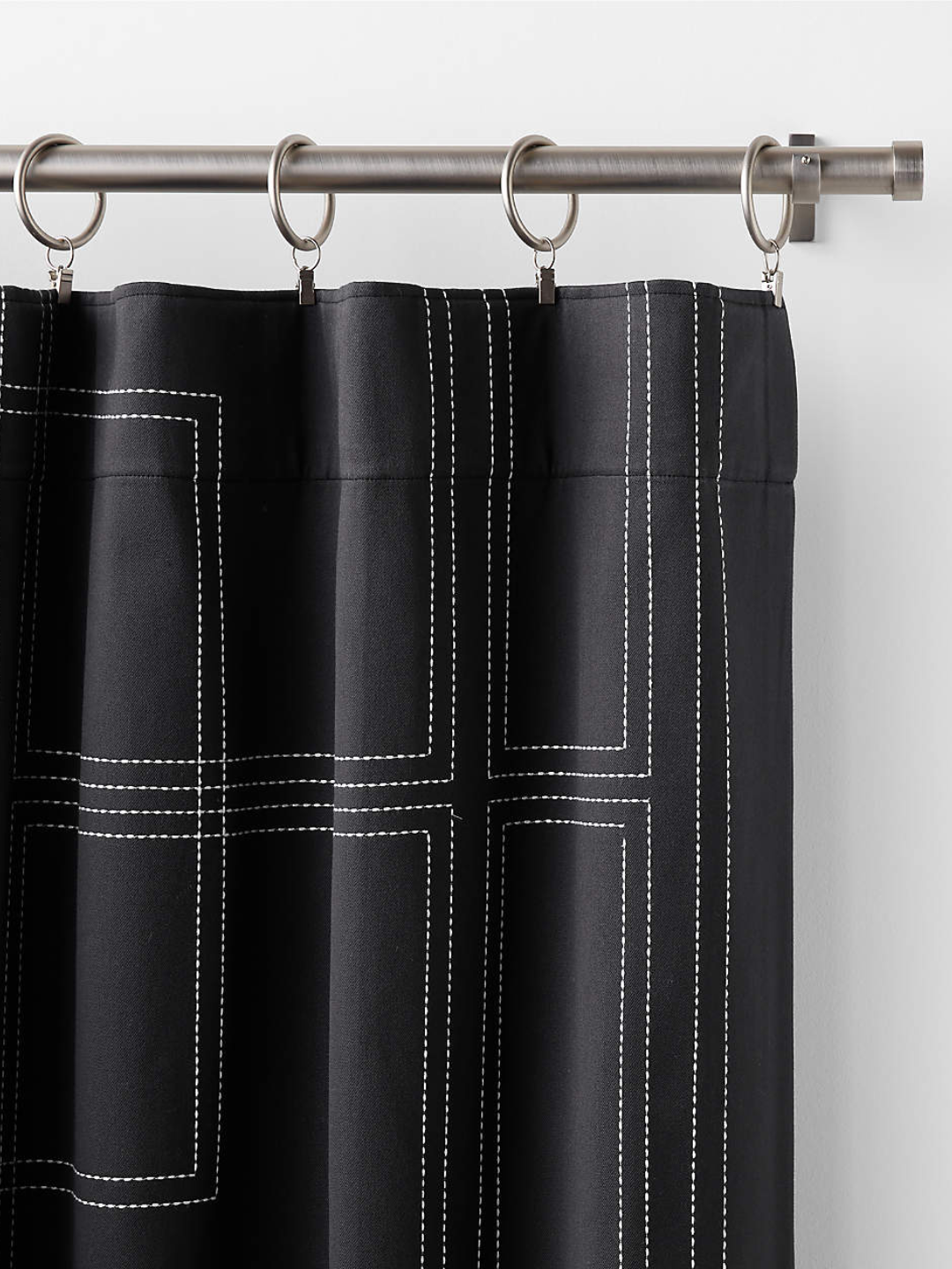 black drapery with white stiching