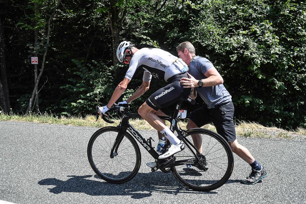Chris Froome remounts after a puncture during stage 10 at the Tour de France