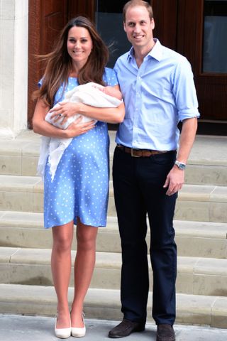 Prince William, Duke of Cambridge and Catherine, Duchess of Cambridge with their newborn son pose for the media before departing the Lindo Wing of St Mary's Hospital on July 23, 2013