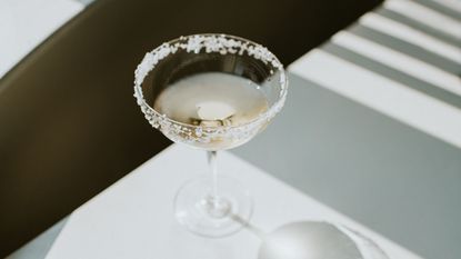 best martini glasses: A martini glass with salt around the rim on a white table