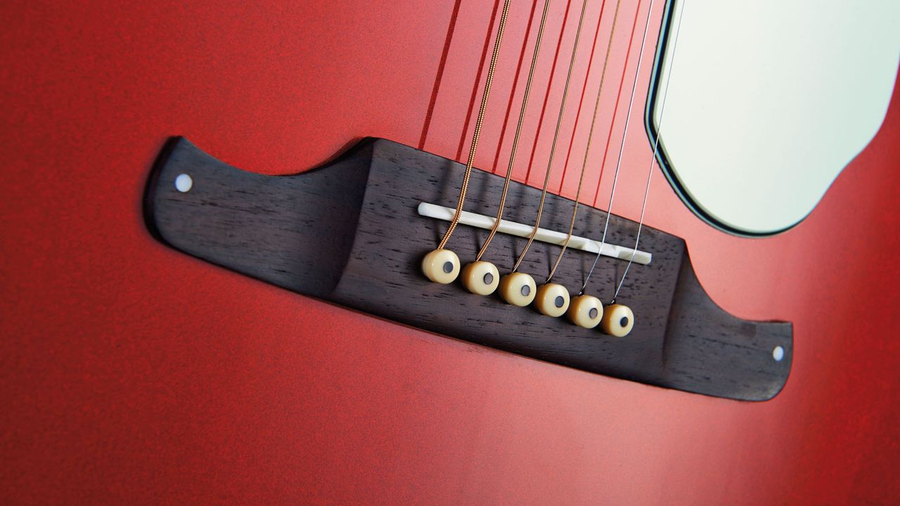 There's a solid rosewood 'Viking'-style pinned bridge with a bone saddle