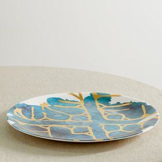 blue and white plates with gold