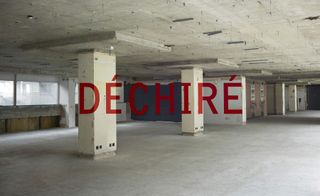 Thomas Tait spring show space location, an a office block in London had the word ‘Déchiré’ was emblazoned across the walls and columns in red paint
