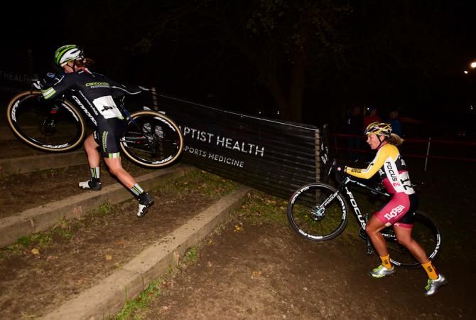 Kaitie Antonneau (Cannondale Cyclocrossworld.com) leading Meredith Miller up a set of stairs on lap two