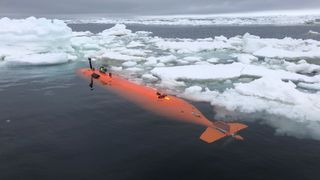 The underwater robot Rán on the ocean's surface shortly before plunging below the Thwaites Glacier to map out the seafloor.