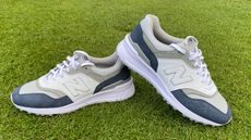 The New Balance 997 SL Golf Shoe on a green background