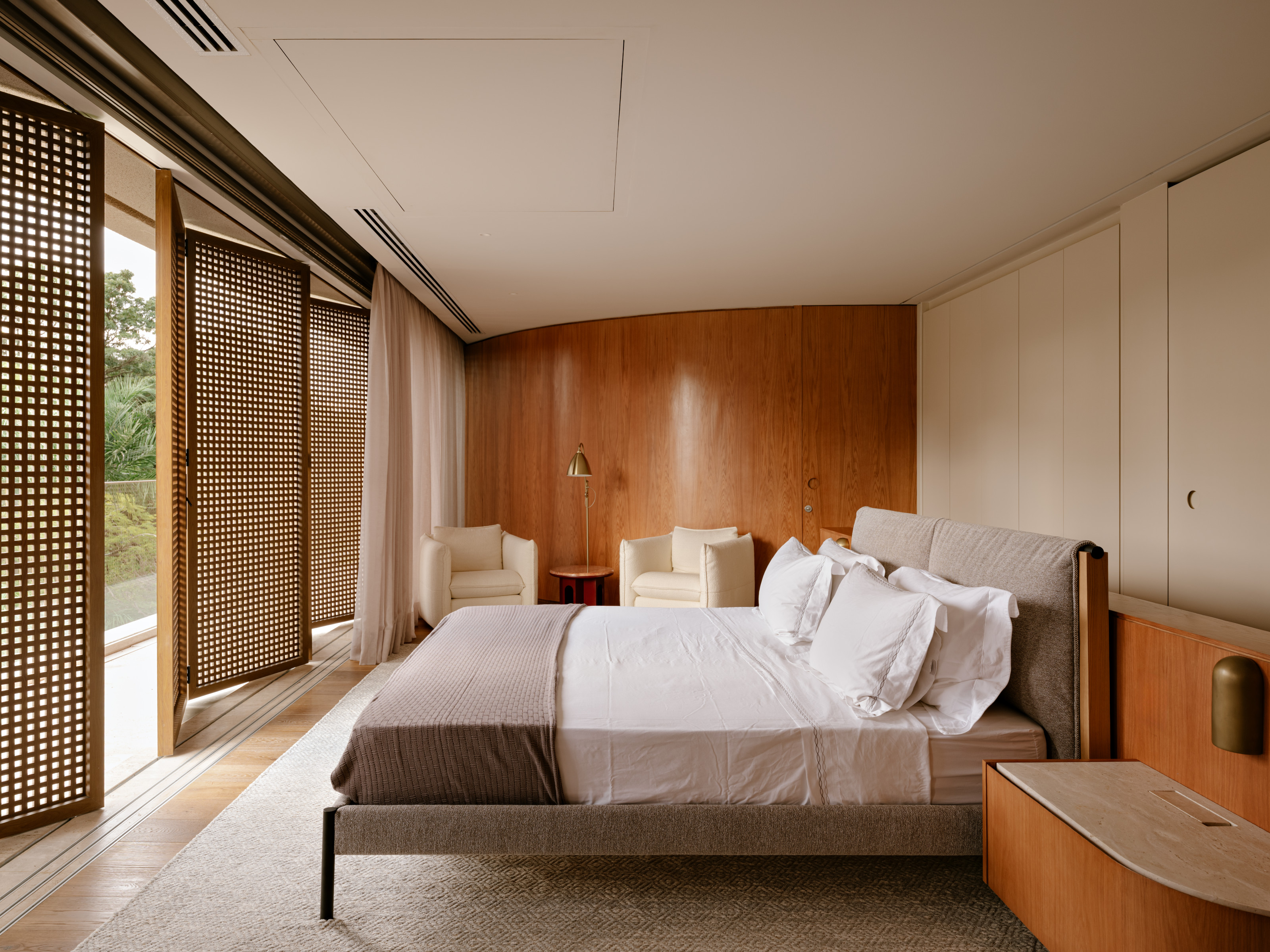 The principal bedroom, with its folding wooden screens