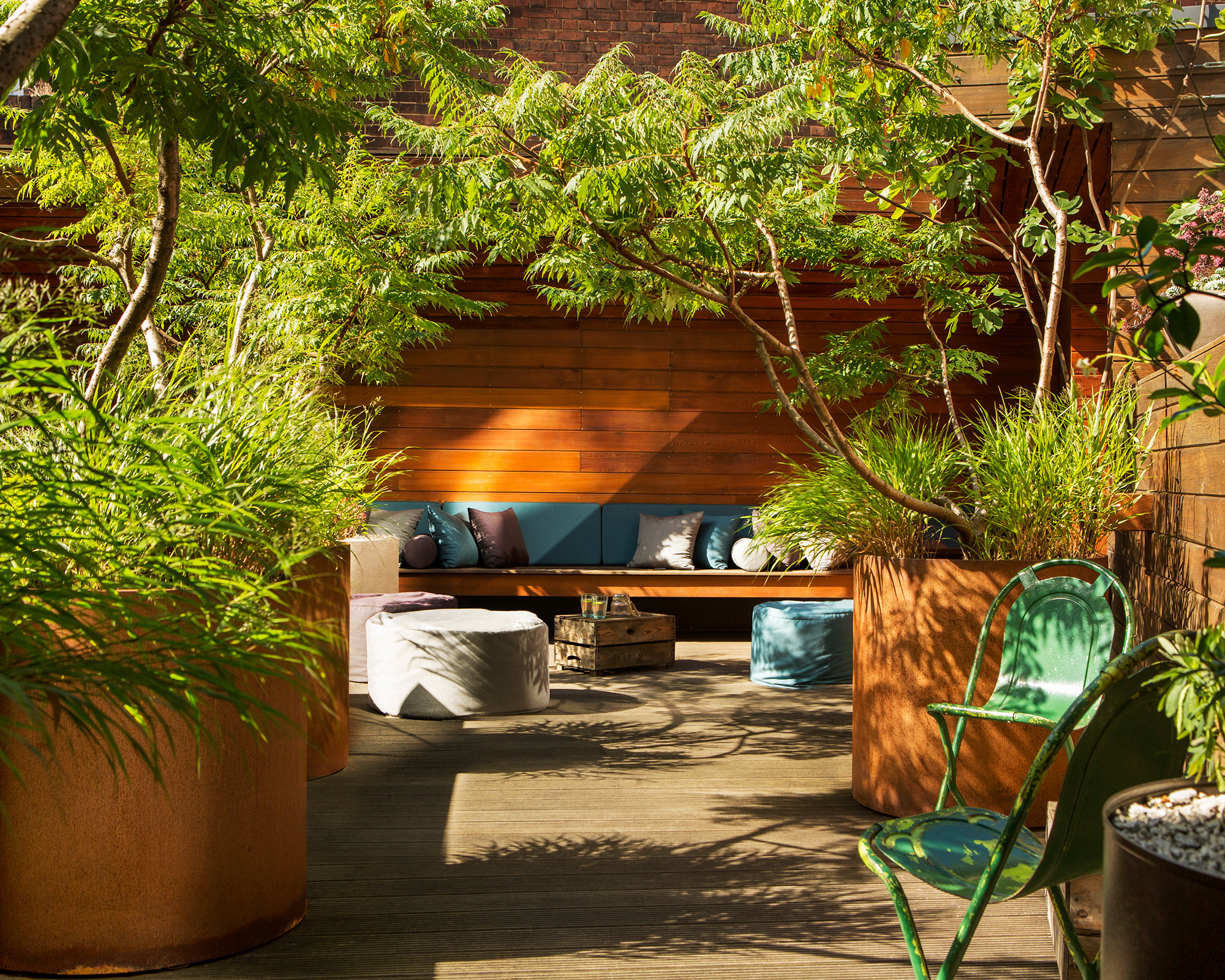 a backyard seating area in a lower terrace