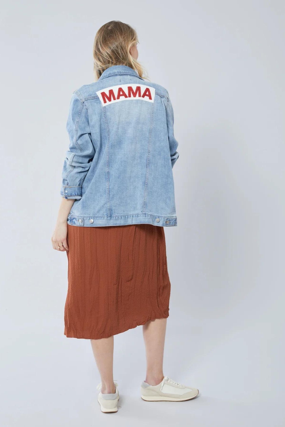 denim jacket that says "MAMA" on the back