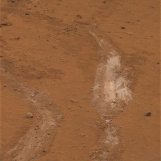 The Spirit rover's jammed right front wheel dug this trench, exposing silica minerals -- strong evidence of hydrothermal activity in Mars' ancient past.