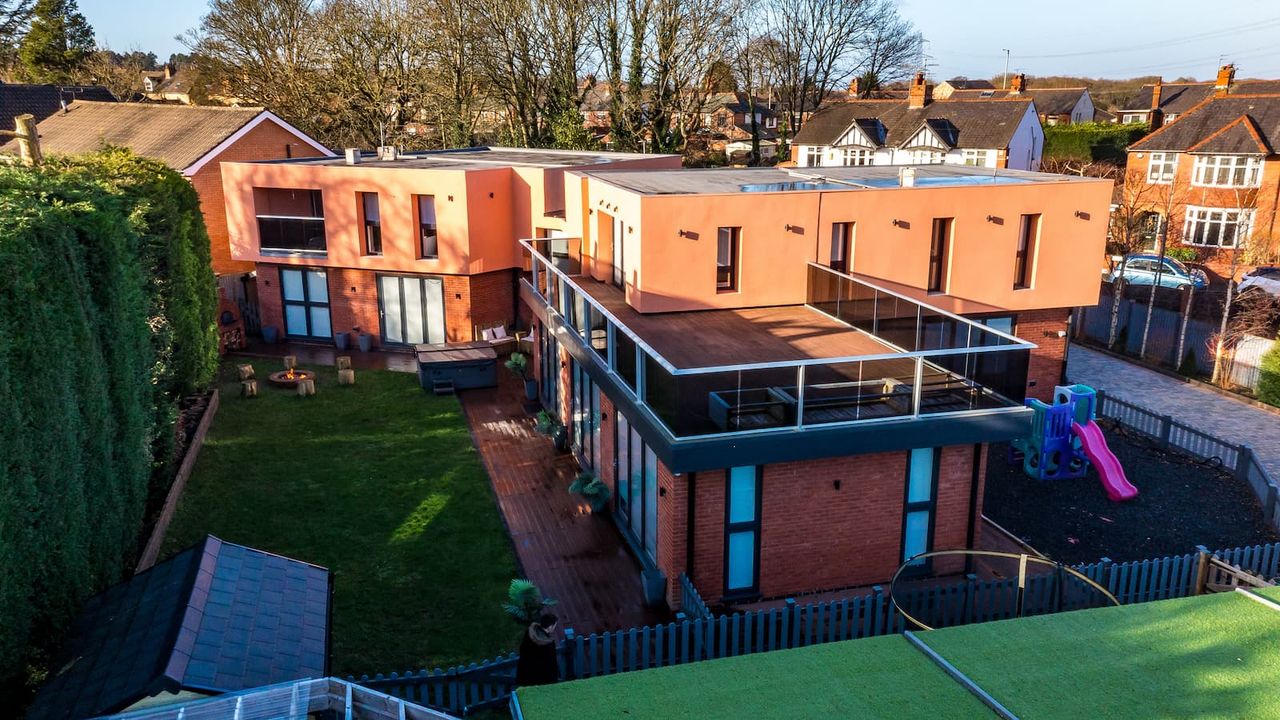 An overhead shot of the AstroTurf pitch and balcony of a house