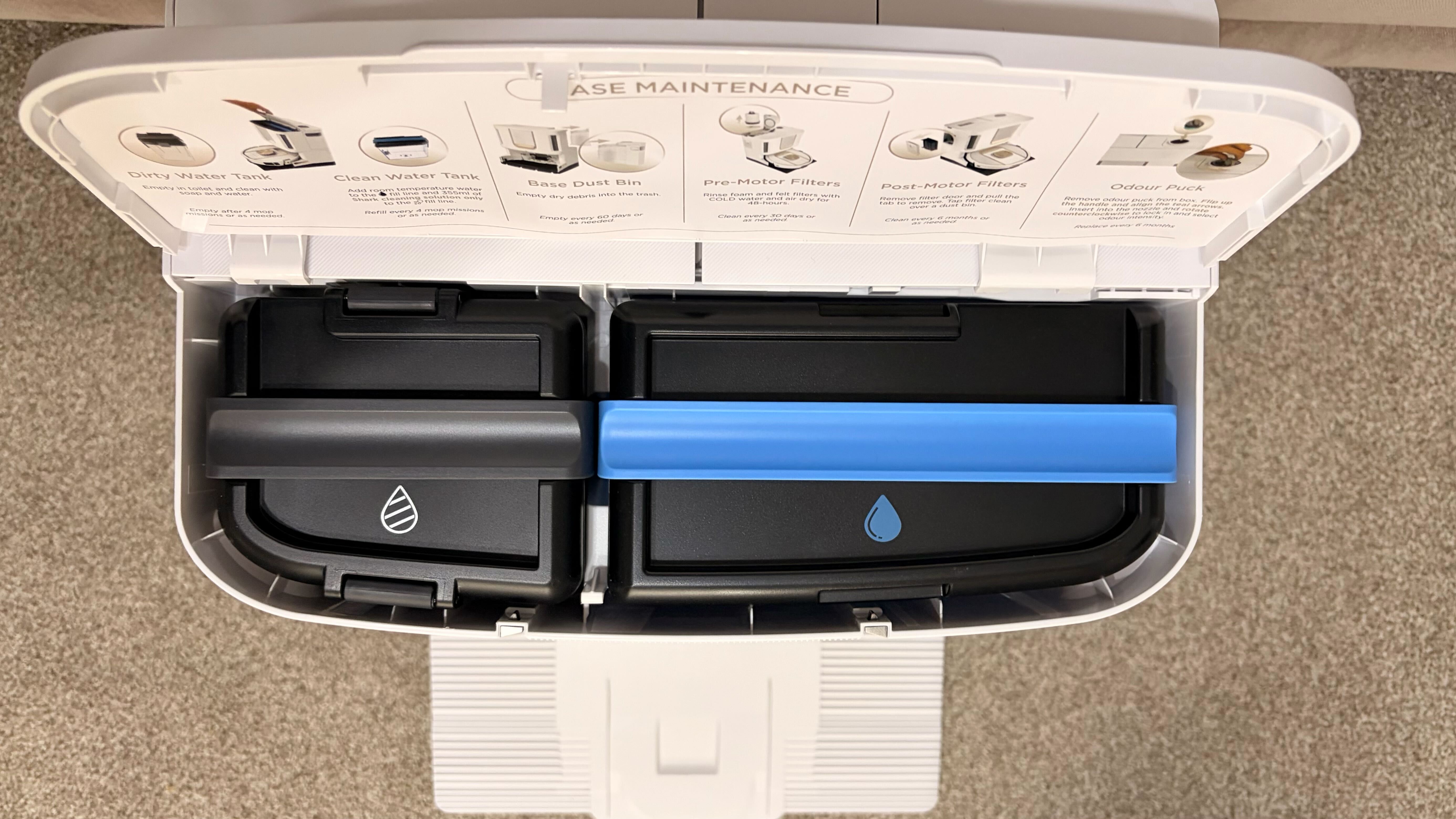 Shark PowerDetect 2-in-1 ThermaCharged NeverTouch photographed on a carpet with docking station