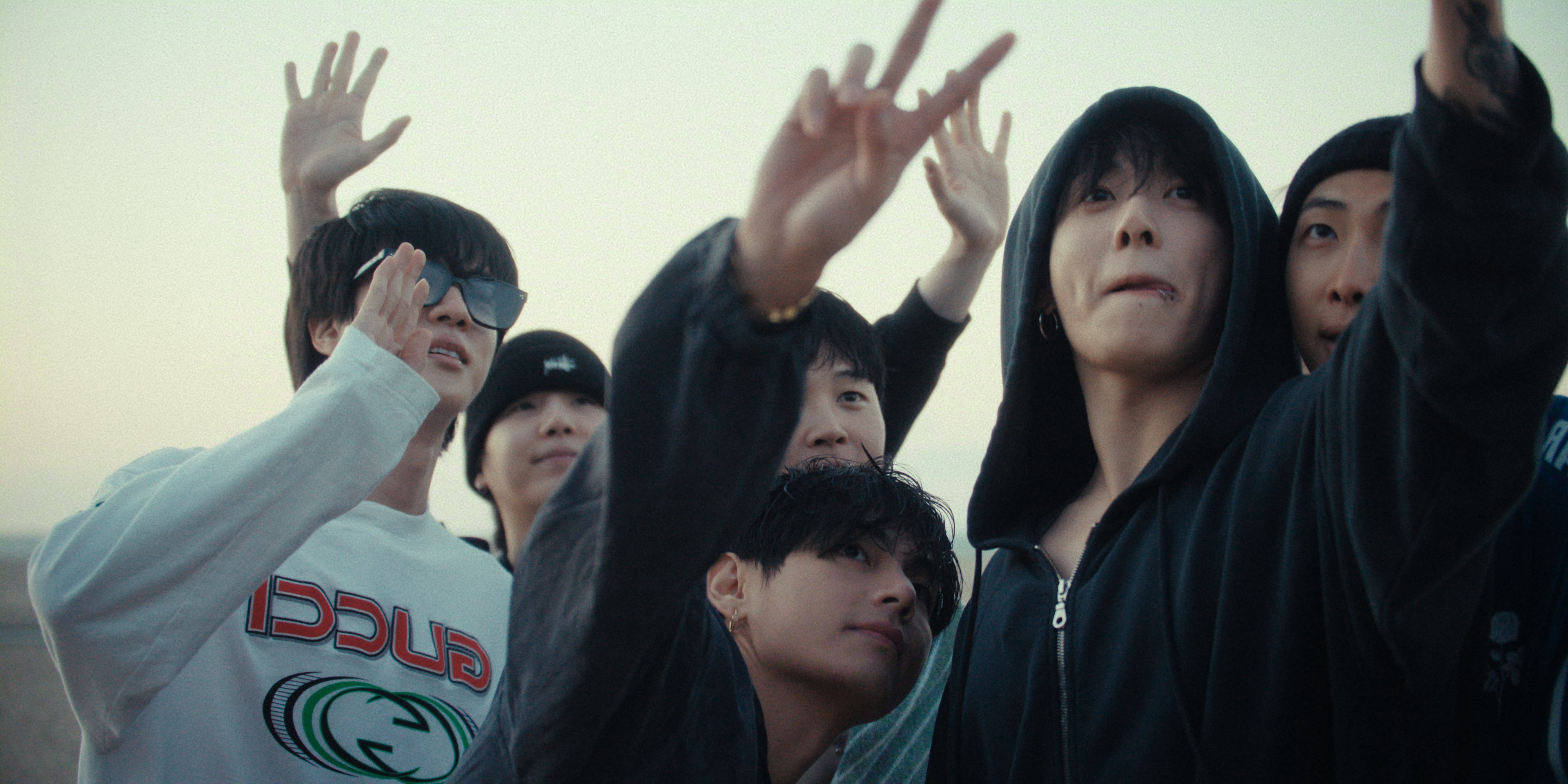 Members of BTS (l-r Jin, Suga, Jimin, V, Jung Kook, and RM) take a group selfie in the Netflix documentary BTS: THE RETURN.