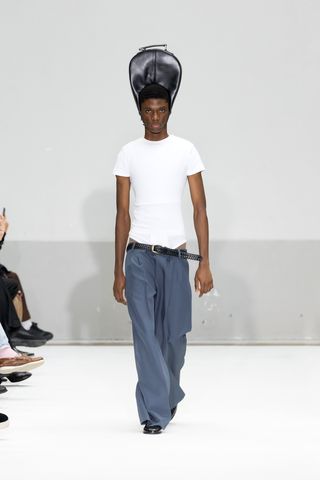 Duran Lantink SS 2025 runway collection with man wearing bag hat