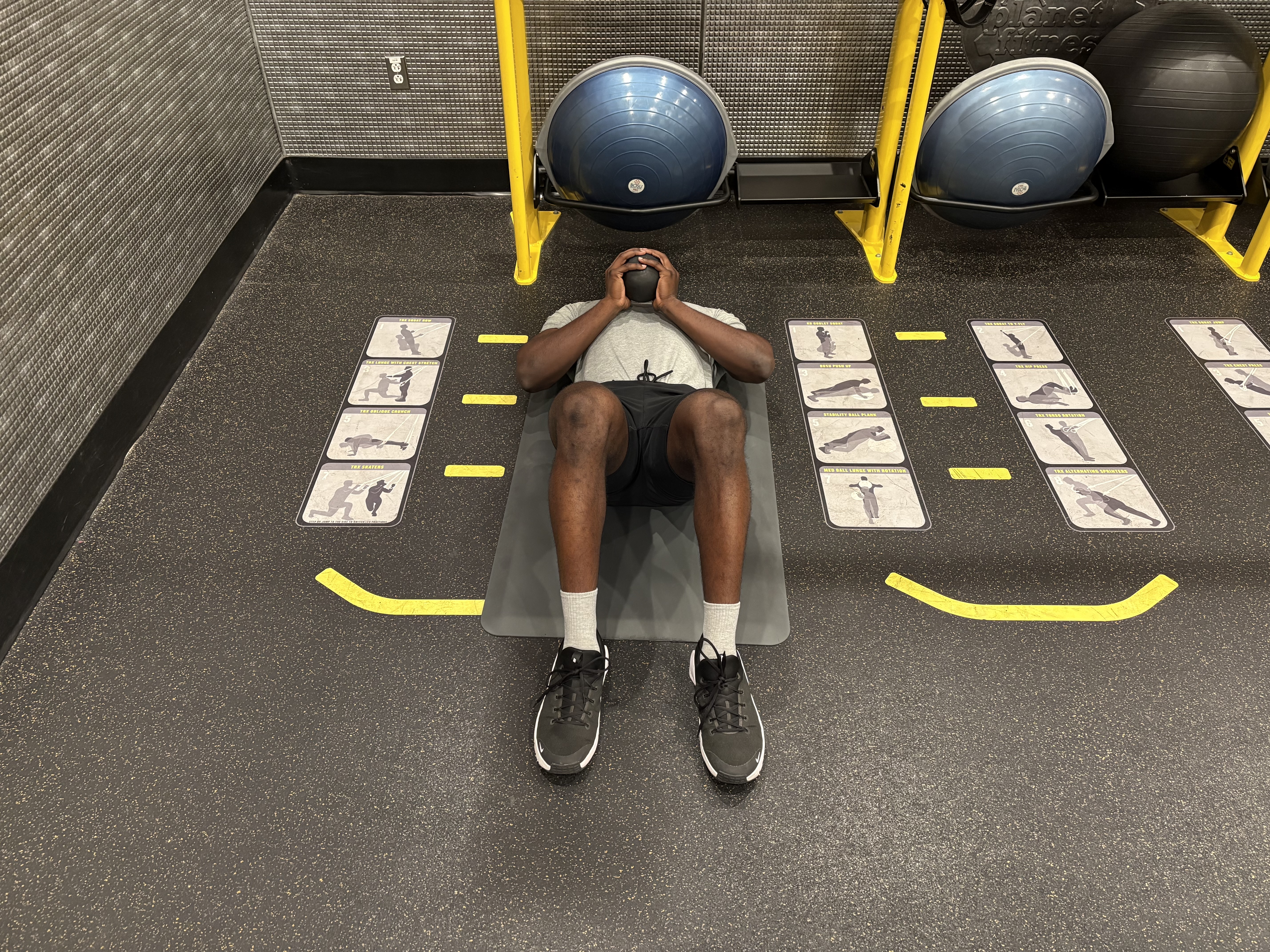 Man exercises with kettlebell in gym