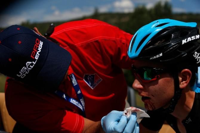 Joe Dombrowski (Team Sky) has his nosebleed attended to by the medical officer