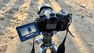 OM System OM-1 Mark II on a tripod at the beach