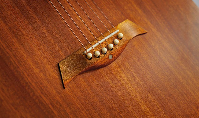 The elegantly shaped mahogany bridge is one area in which Anderwood has evolved the early Weissenborn design