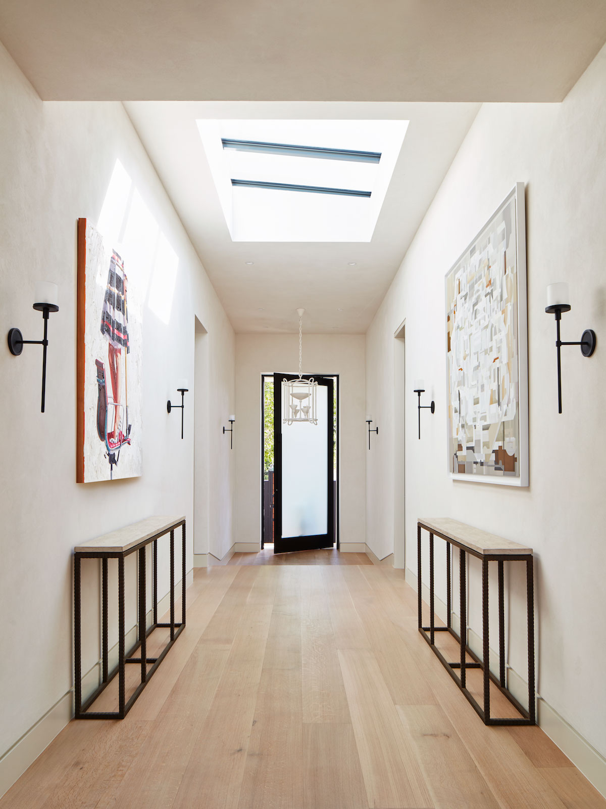 All white hallway with statement artwork