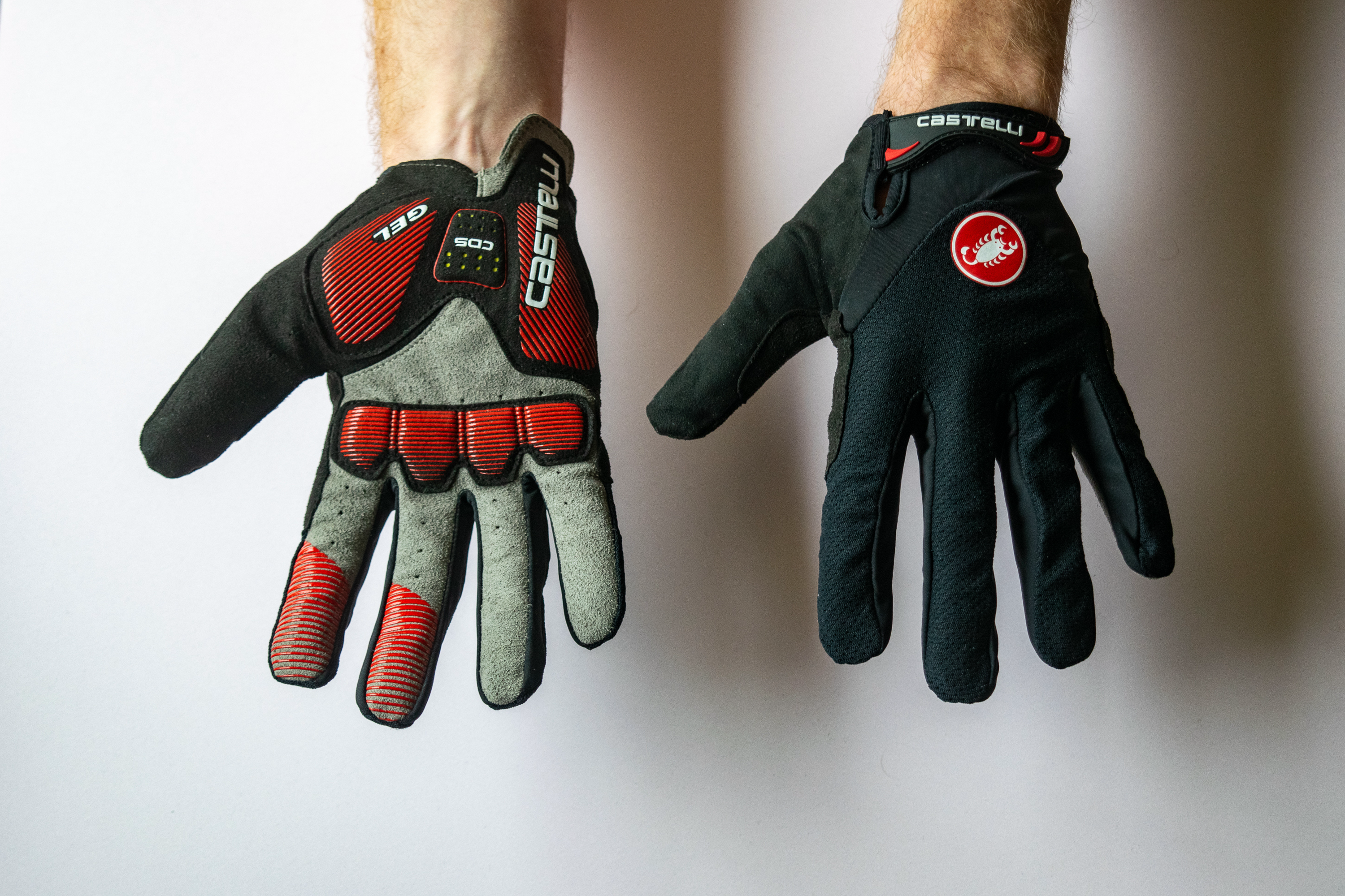 A rider wearing Castelli Arenberg Gel LF gloves showing the back of the hand and the palm