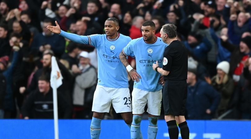 Manchester City players Riyad Mahrez and Manuel Akanji protest with the assistant referee after Manchester United&#039;s equaliser in the derby at Old Trafford.