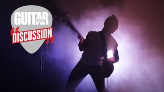 Silhouette of a guitar player on stage