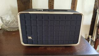 JBL Authentics 300 wireless speaker from front on wooden furniture