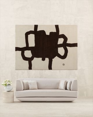 White armani casa sofa with abstract black and white artwork by Eduardo Chillida