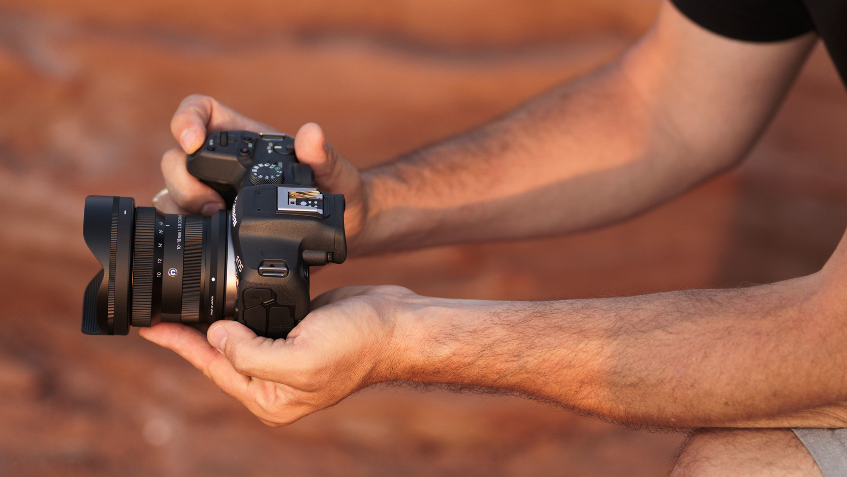 Hands on the Sigma 10-18mm F2.8 DC DN lens attached to a Canon camera