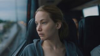 Lynsey (Jennifer Lawrence) stares out a bus window in Causeway