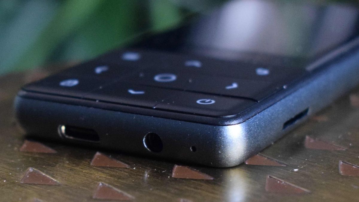 The Oakcastle MP300 laying flat on a table, showing its buttons and ports.