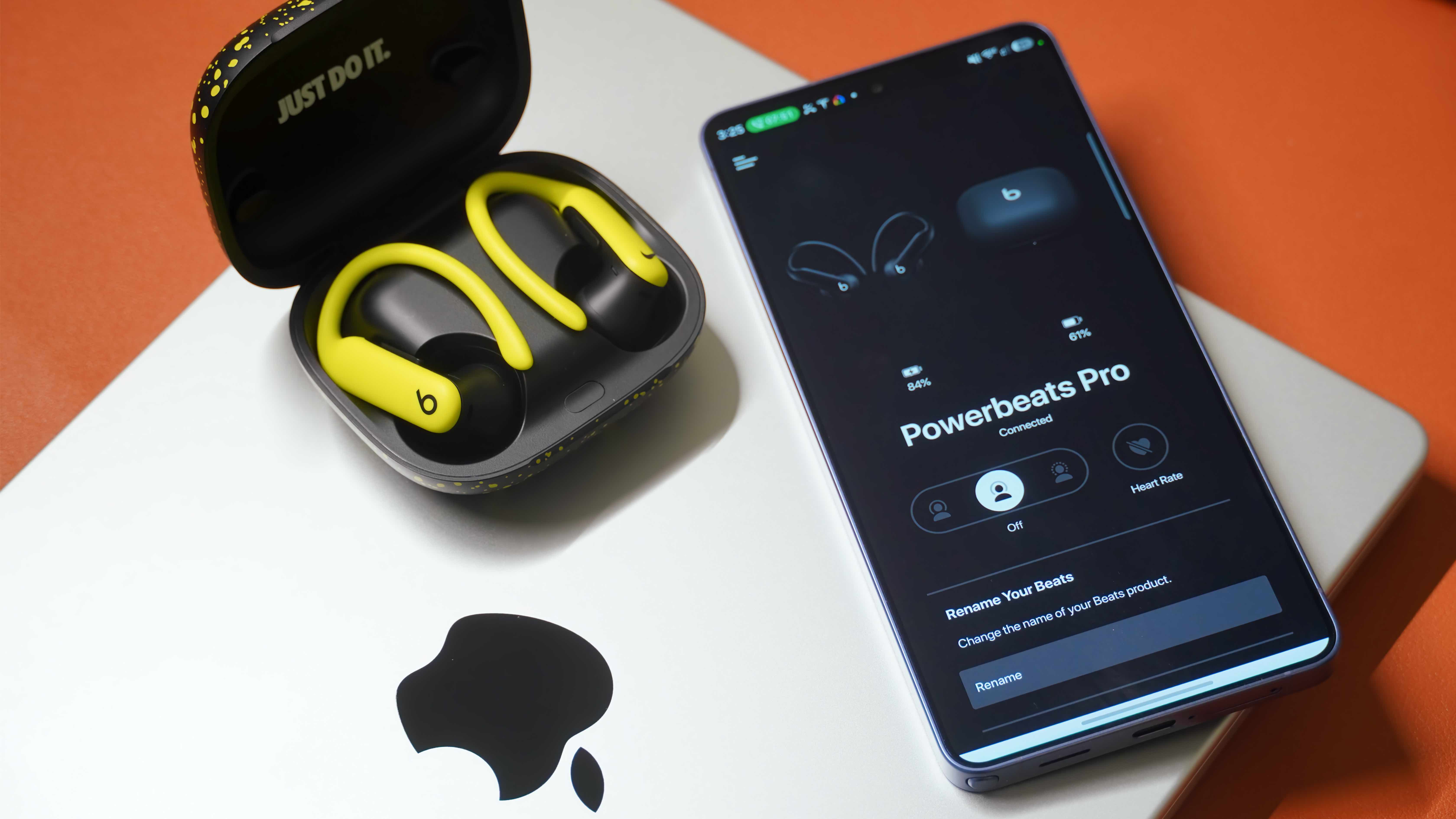 The Nike Special Edition variant of the Powerbeats Pro 2 in a volt and matte black colorway.