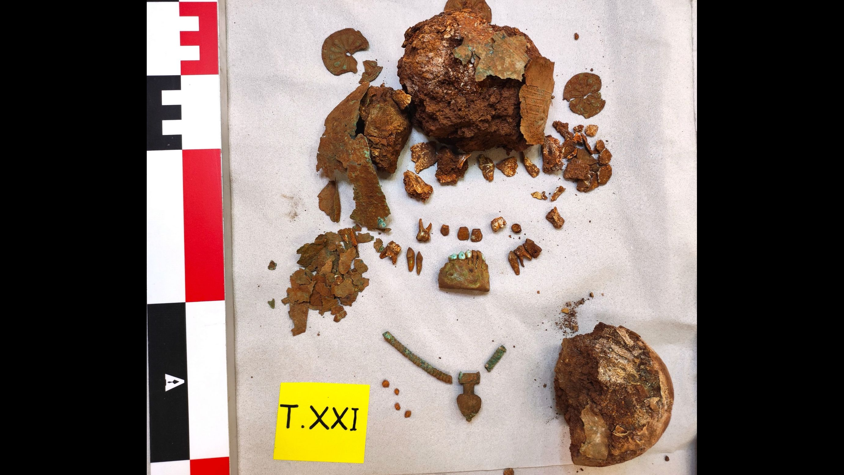 human skeletal remains of an ancient child with bronze jewelry