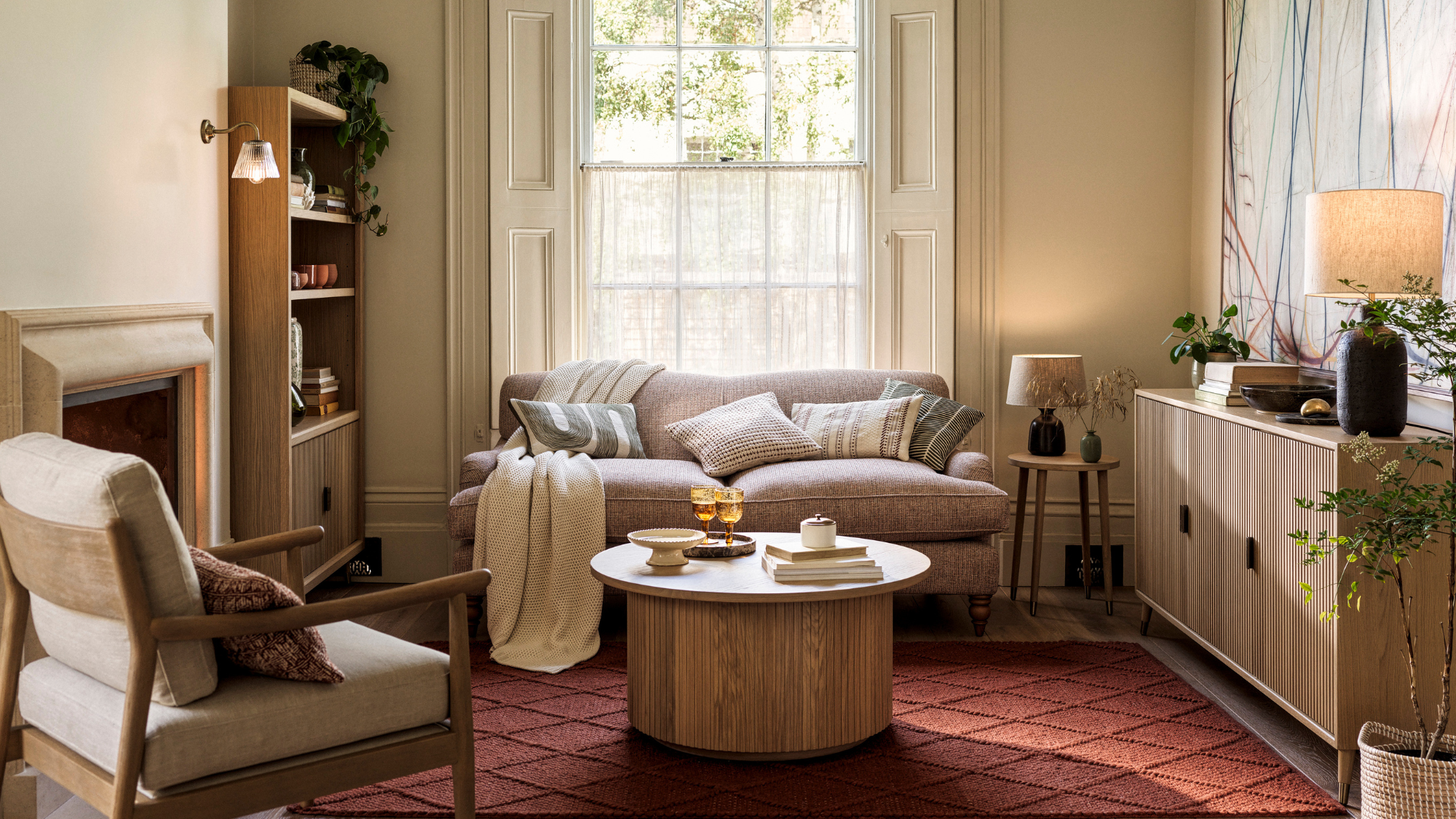 Living room with beige colours and rust orange rug